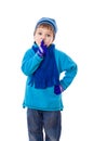 Smiling boy in winter clothes showing silence sign Royalty Free Stock Photo