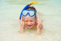 Smiling boy 7 years in a snorkeling mask