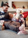 Boyfriend giving puppy dog as Christmas present to girlfriend Royalty Free Stock Photo