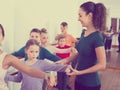 Smiling boys and girls rehearsing ballet dance in studio Royalty Free Stock Photo