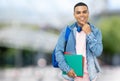 Smiling brazilian male student with braces