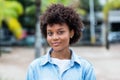 Smiling brazilian young adult woman outdoor in summer