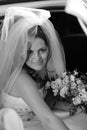 Smiling bride getting out car Royalty Free Stock Photo