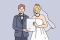 Smiling bride and groom hold marriage certificate