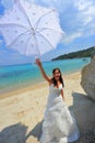 Smiling bride holding sun umbrella portrait Royalty Free Stock Photo