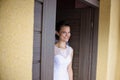 Smiling bride waiting for the groom