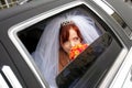Smiling bride in wedding car limo Royalty Free Stock Photo