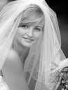 Smiling bride in white wedding dress