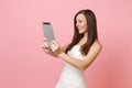 Smiling bride woman in wedding dress working doing taking selfie shot on tablet computer, making video call on Royalty Free Stock Photo