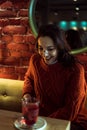 smiling brunette in a coffee shop