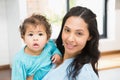 Smiling brunette holding her baby Royalty Free Stock Photo