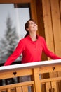 Smiling Woman on a balcony in winter