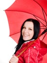 Smiling brunette woman in fall, rainproof clothes
