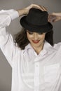 Smiling brunette woman with hat and red lips