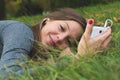 Smiling brunnette woman using cell phone Royalty Free Stock Photo