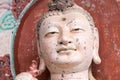 Smiling buddha closeup in maiji mountain grottoes