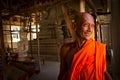 A smiling Buddhist monk in his temple in Sukhothai, Thailand