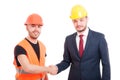 Smiling builder and businessman greeting each other