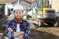 smiling builder repairman worker in dirty workwear at construction site Royalty Free Stock Photo