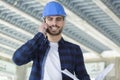smiling builder talking on cell phone Royalty Free Stock Photo