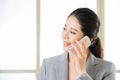 Smiling Business asian Woman talking on a Mobile phone Royalty Free Stock Photo