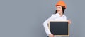 Smiling business builder woman with board. Woman worker builder hold sign board blank. Building hardhat helmet. Woman Royalty Free Stock Photo