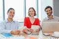 Smiling business executives using laptop and digital tablet in conference room Royalty Free Stock Photo