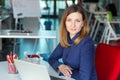 Smiling Business Lady in casual clothing sitting at Office Table Royalty Free Stock Photo