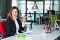 Smiling Business Lady in official clothing holding Coffee Mug Royalty Free Stock Photo