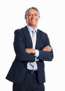 Smiling business man with hands folded. Portrait of handsome mature business man standing with arms crossed on white Royalty Free Stock Photo