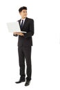 Smiling business man holding laptop Royalty Free Stock Photo