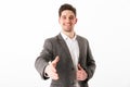 Smiling business man in jacket giving his hand to handshake Royalty Free Stock Photo