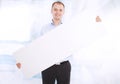 Smiling business man presents a white banner Royalty Free Stock Photo