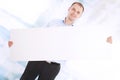 Smiling business man presents a white banner Royalty Free Stock Photo