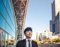 Smiling business man standing in front of  office building Royalty Free Stock Photo