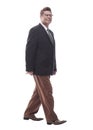 Smiling business man walking towards you . isolated on a white Royalty Free Stock Photo