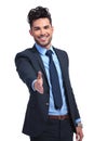 Smiling business man is welcoming you with a hand shake Royalty Free Stock Photo