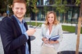 Smiling business man and woman meeting outdoor.Young employees  outdoor Royalty Free Stock Photo