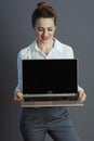 smiling business owner woman showing laptop blank screen Royalty Free Stock Photo