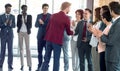 Smiling business partners handshaking in the sign of successful dealing Royalty Free Stock Photo