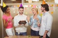 Smiling business people with birthday cake enjoying the party Royalty Free Stock Photo