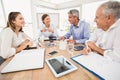 Smiling business people having a meeting Royalty Free Stock Photo