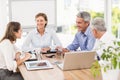 Smiling business people having a meeting Royalty Free Stock Photo