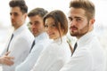 Smiling business people standing together in line in a modern of Royalty Free Stock Photo