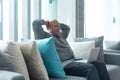 Smiling business senior old elderly Black American man, African person working from home on table with computer notebook laptop in Royalty Free Stock Photo