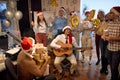 Smiling business team have fun and dancing in Santa hat at Xmas party Royalty Free Stock Photo