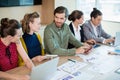 Smiling business team interacting with each other in conference room Royalty Free Stock Photo