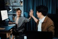 Smiling business trader with partner in casual suit taking high five. Infobahn.