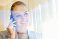 Smiling business woman having a conversation on cellphone. Cute young business woman speaking over the cellphone , view Royalty Free Stock Photo