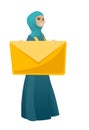 Smiling business woman holding a big envelope. Royalty Free Stock Photo